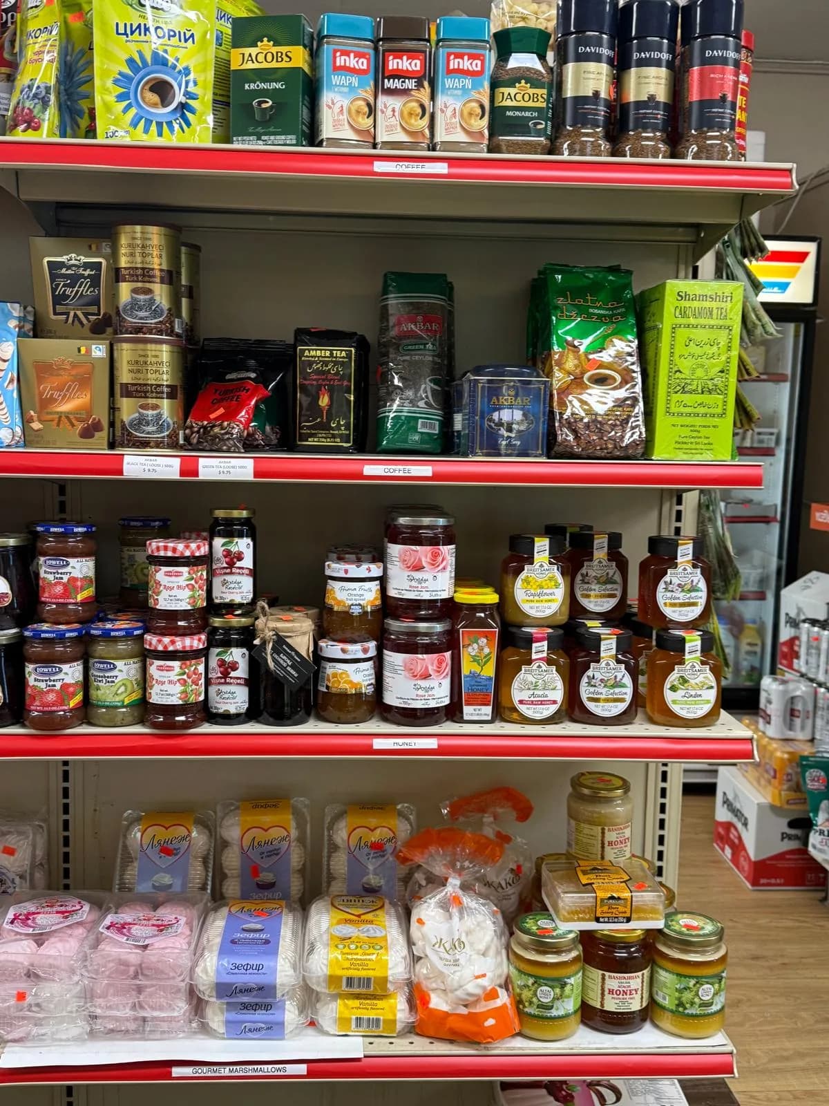 Fruit preserves and sweets along a market shelf