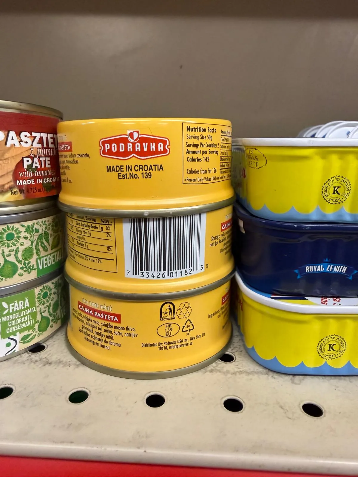 Tinned pâtés and preserved fish on the shelf